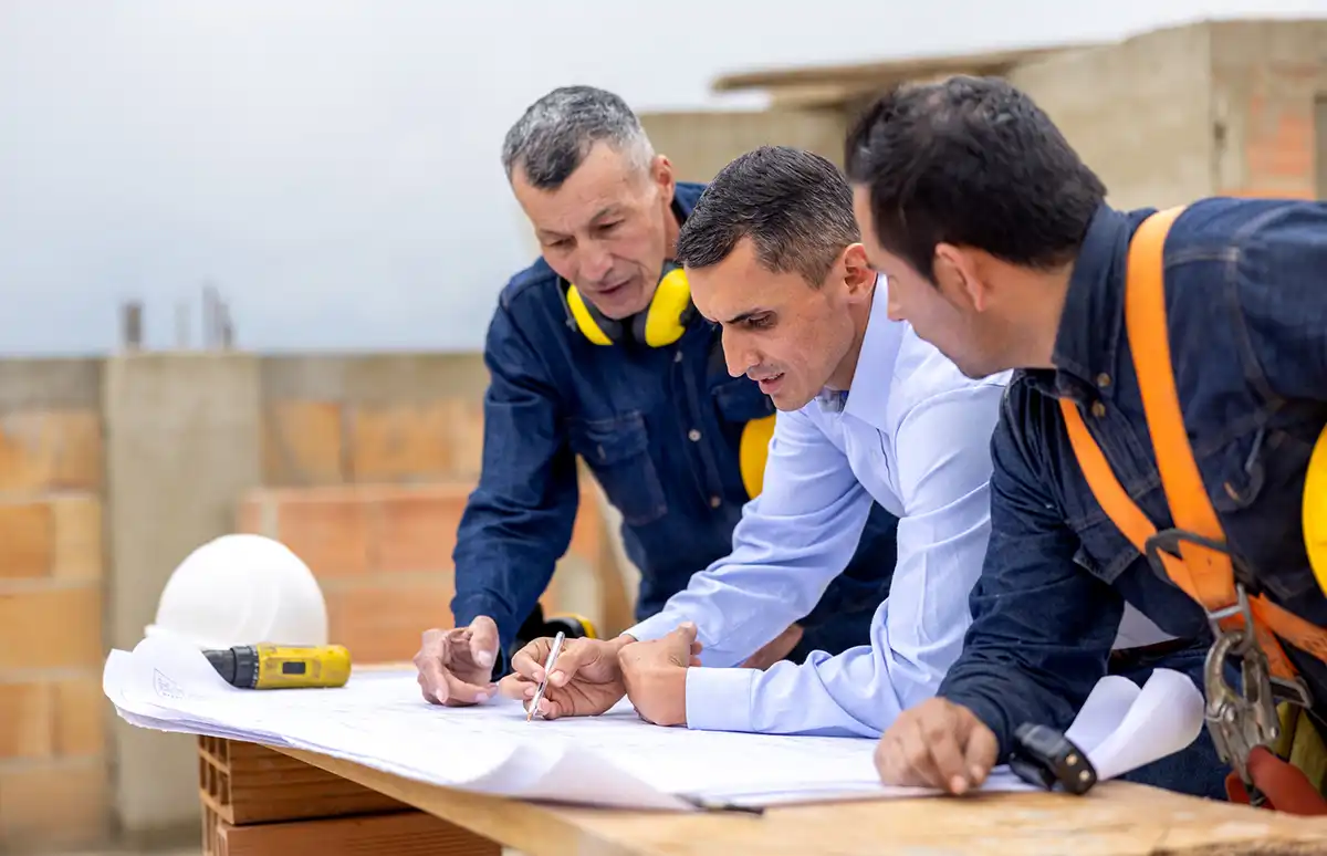 Full Court Construction Experts Looking at Plans